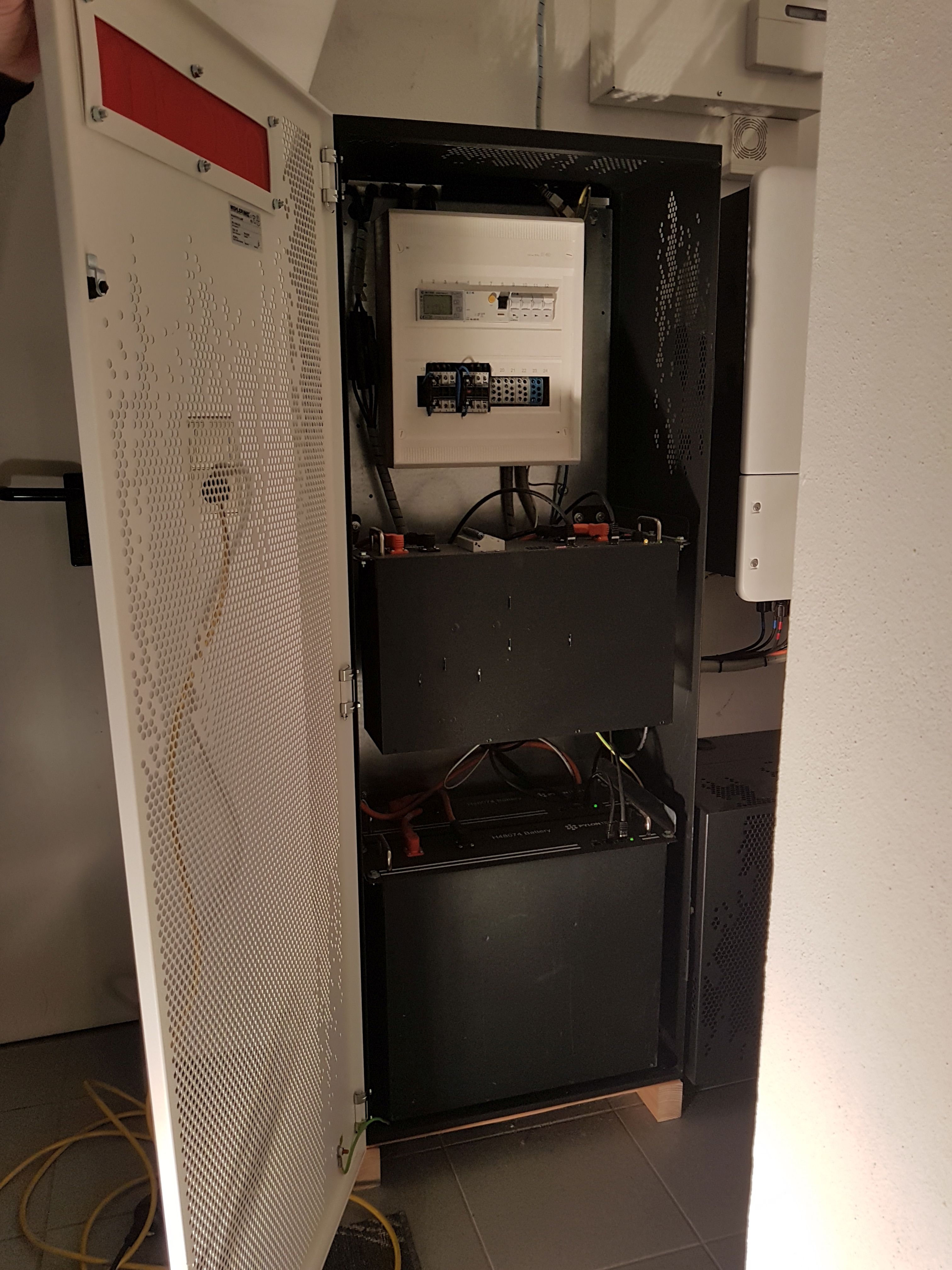 Archival photograph: inside a KJUUBE photovoltaic battery-storage cabinet, 30 November 2020.